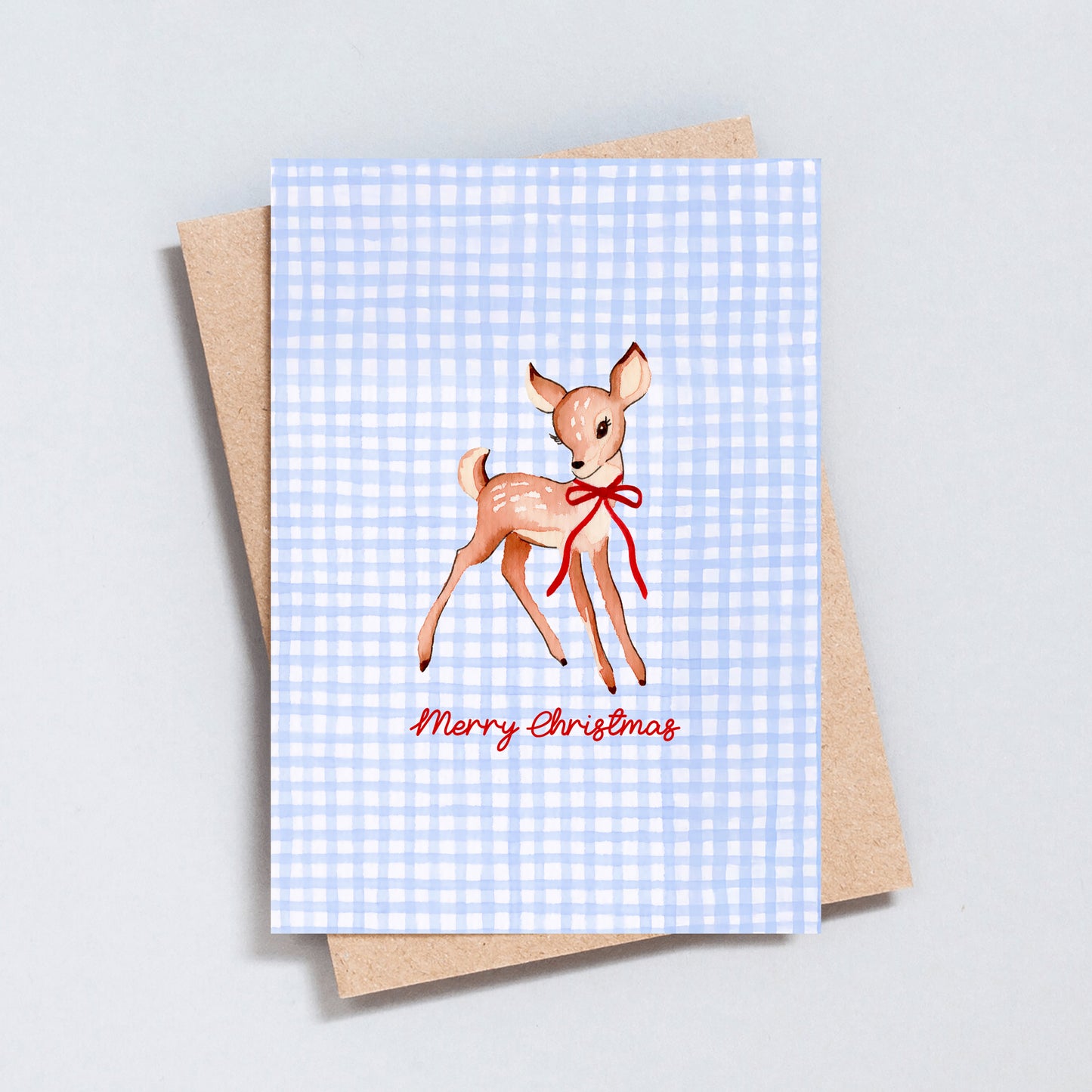 Merry Christmas card featuring a hand-painted deer with a red bow on a blue gingham background – The Type Club