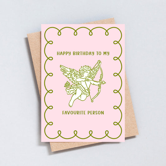Greeting card with pink and green Cupid illustration, romantic birthday design