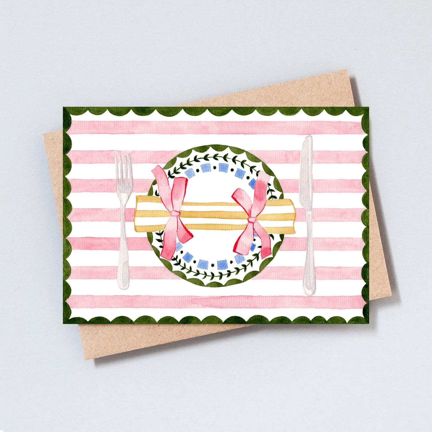 Watercolour Christmas table setting greeting card with festive cracker and pink bow