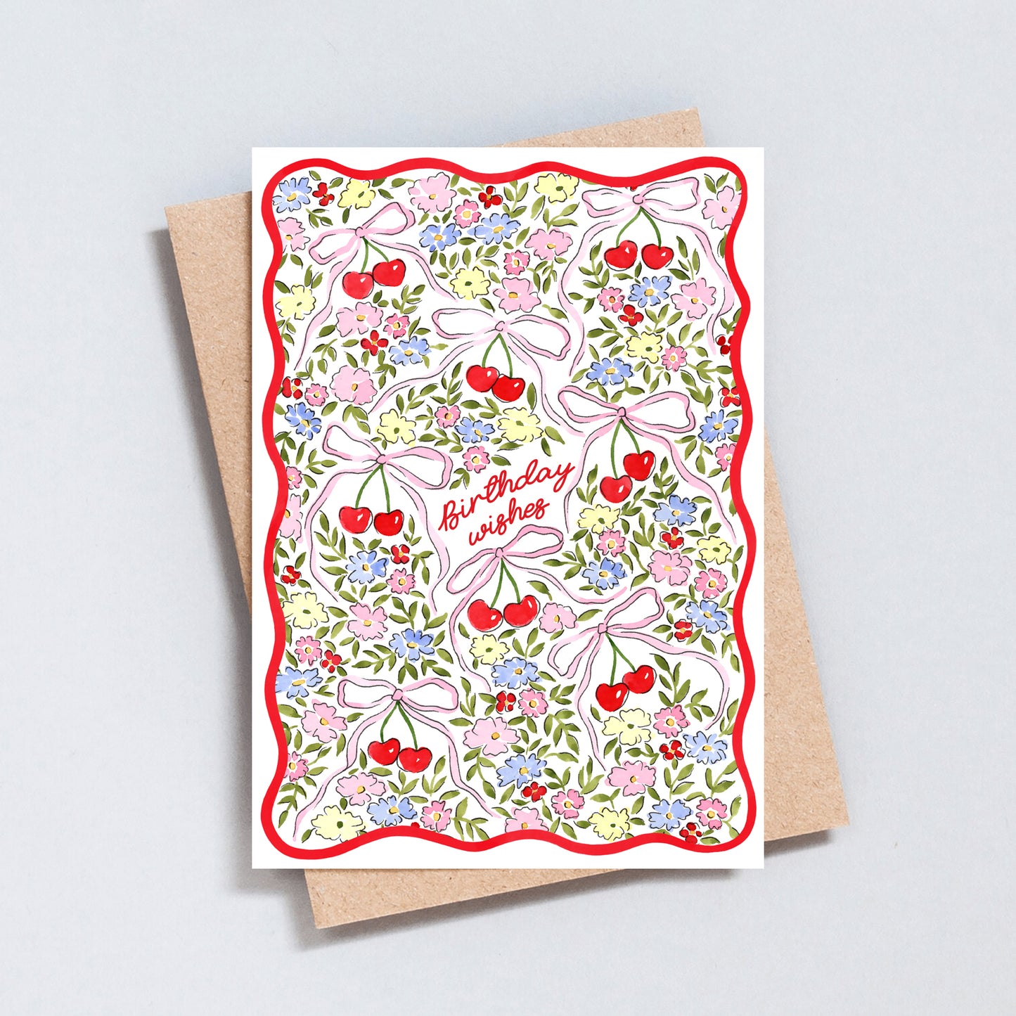 Floral cherry birthday card with pink bows, colourful flowers and red wavy border on textured white background