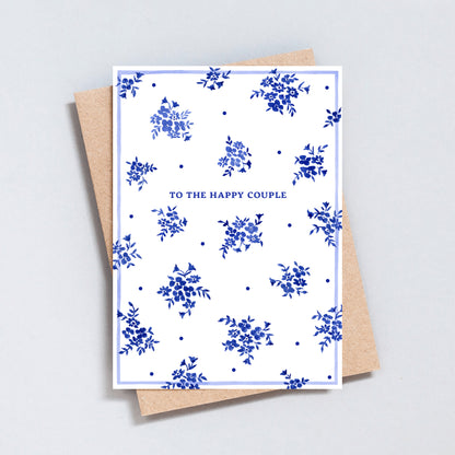 Elegant blue floral wedding card with minimal design and happy couple text