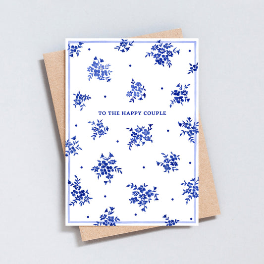 Elegant blue floral wedding card with minimal design and happy couple text
