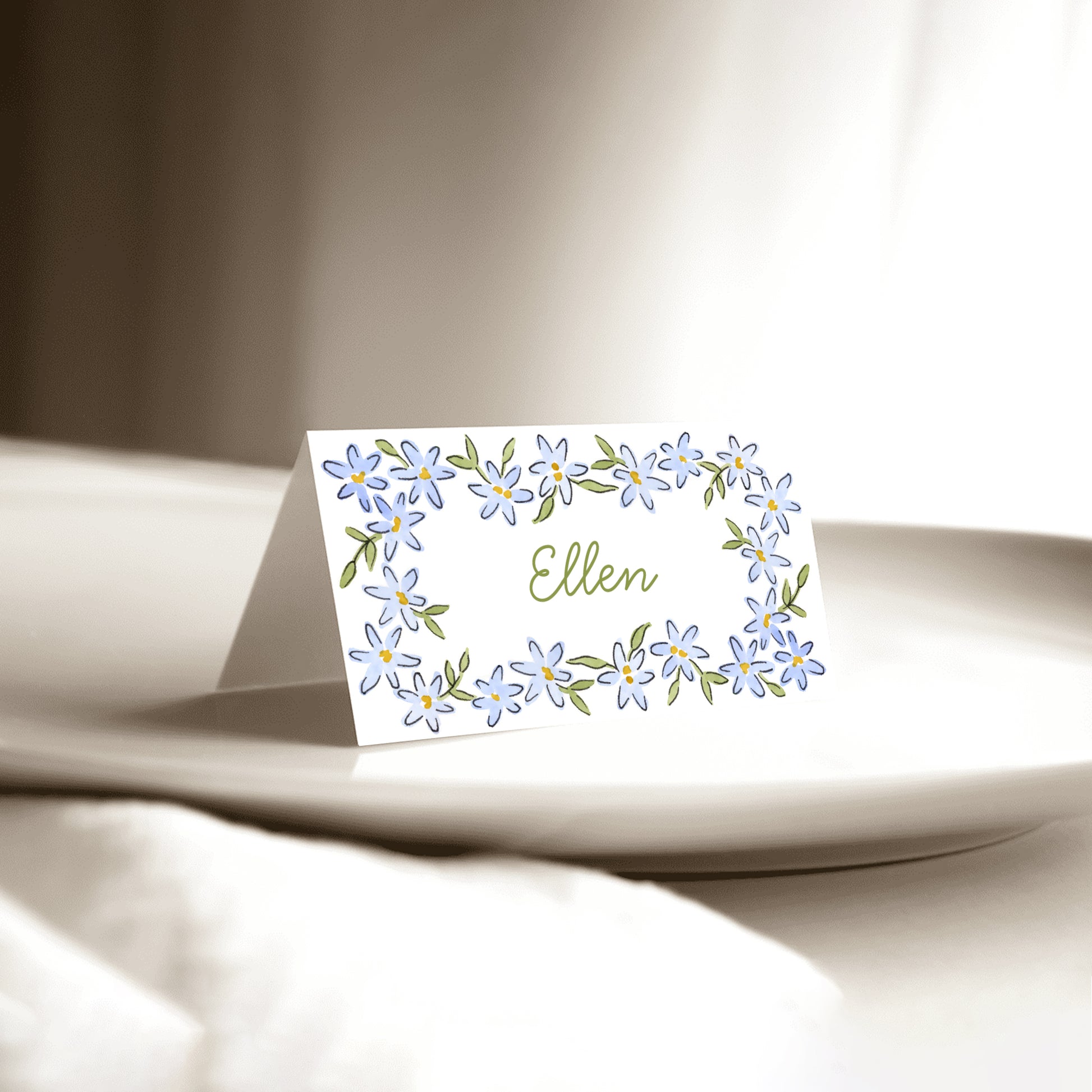 Blue floral personalised place cards with guest names