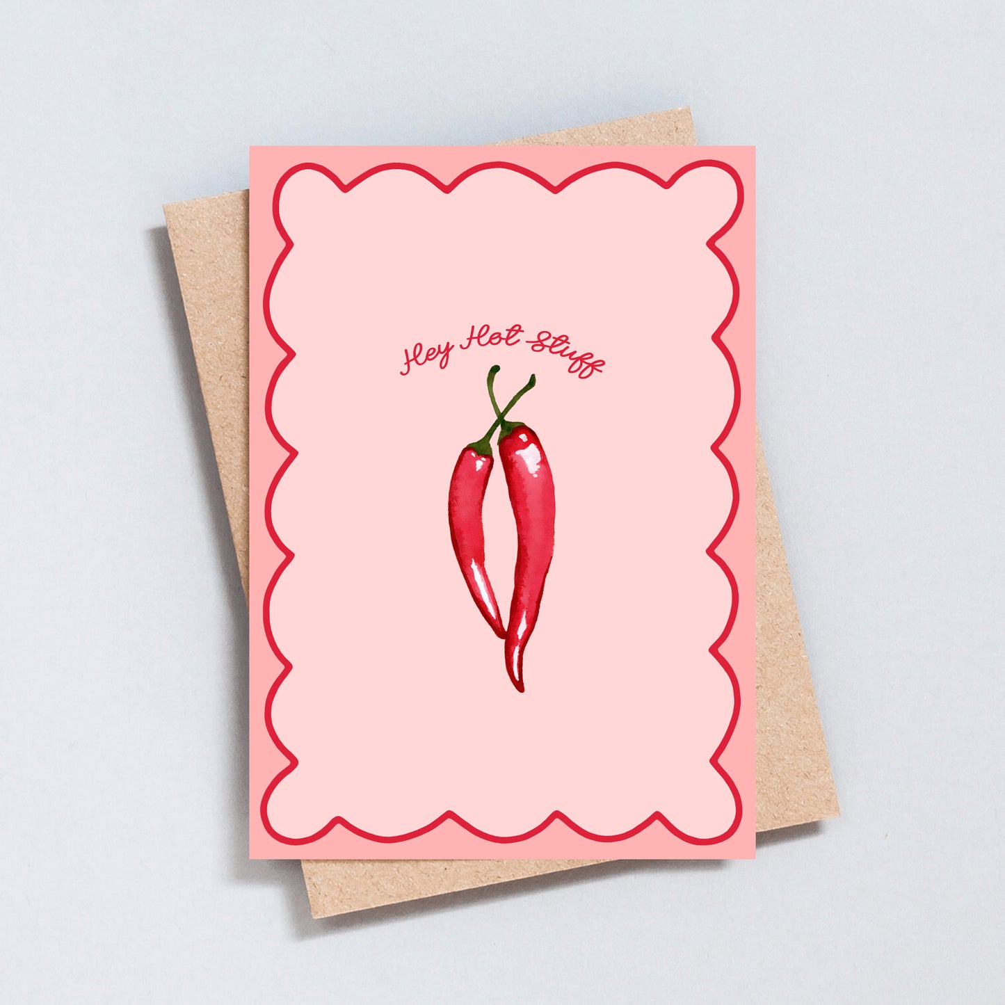 Funny “Hey Hot Stuff” card with two red chillies on a pink scalloped background.