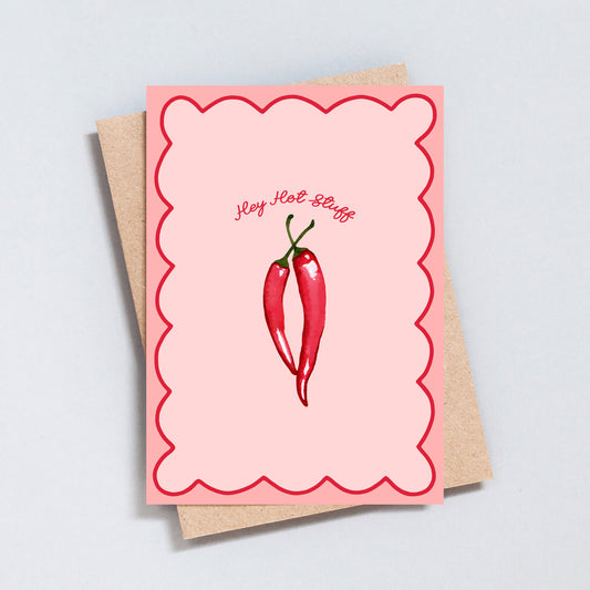 Funny “Hey Hot Stuff” card with two red chillies on a pink scalloped background.