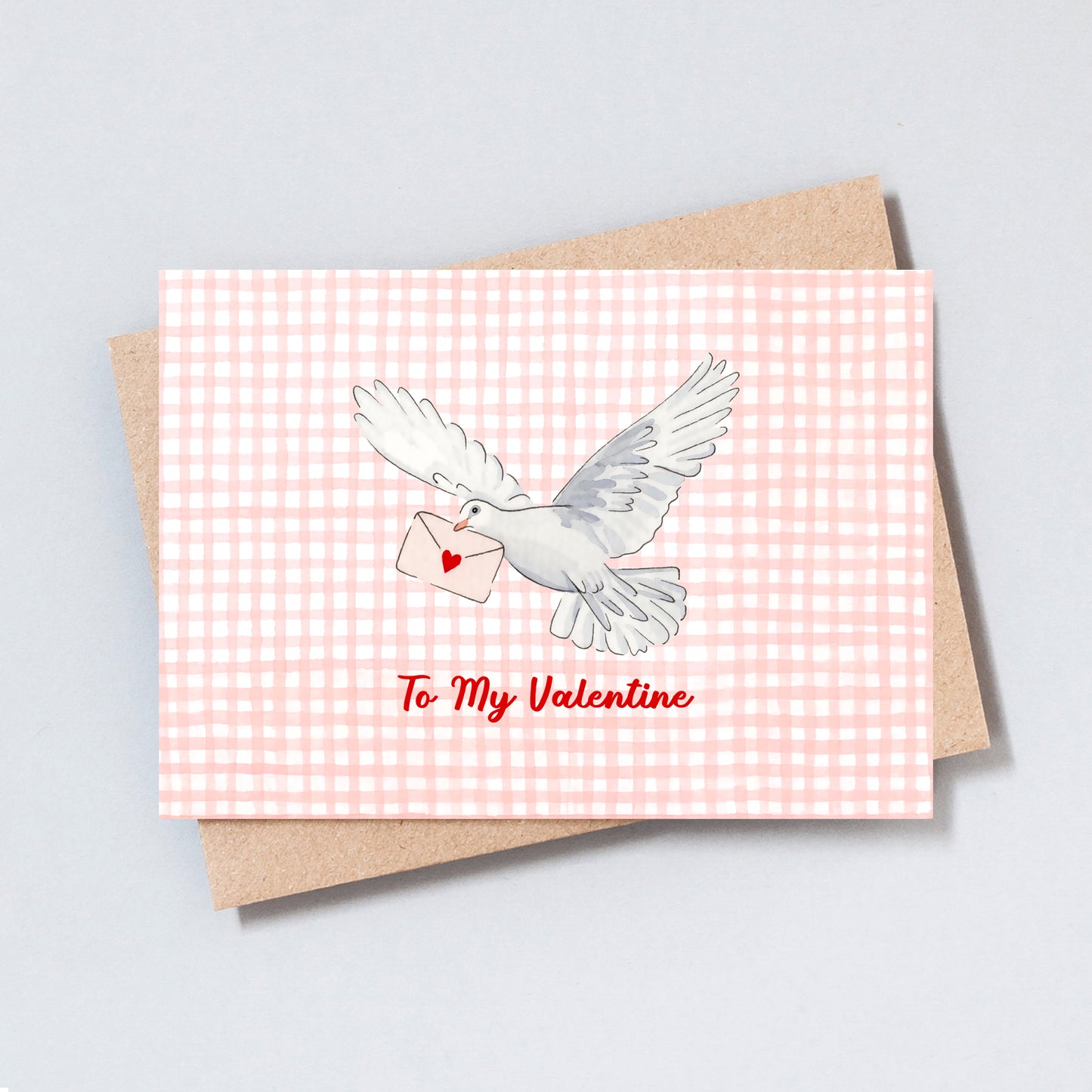 Hand-drawn dove carrying a love letter on a pink gingham background with the text “To My Valentine”.