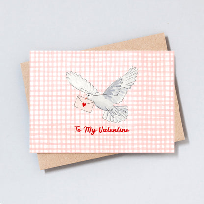 Hand-drawn dove carrying a love letter on a pink gingham background with the text “To My Valentine”.