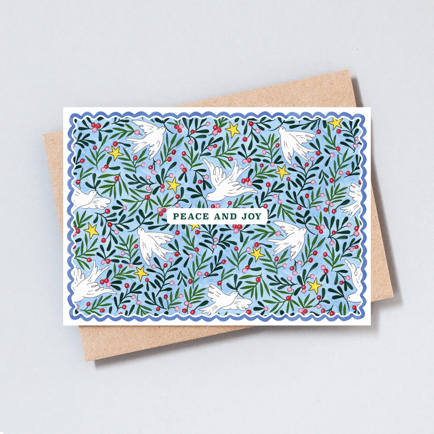Illustrated Peace and Joy Christmas card featuring white doves, evergreen foliage, winter berries and golden stars on a soft blue background.