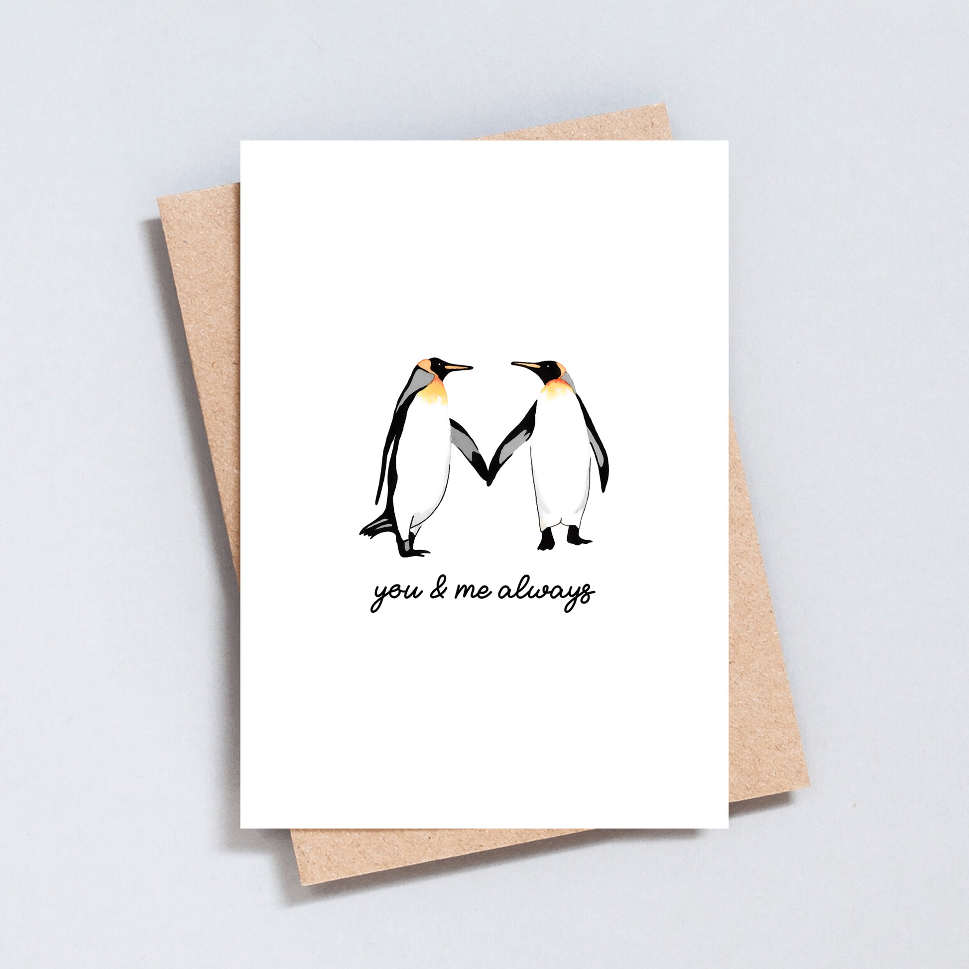 Love card with two penguins holding hands and the text “you & me always”