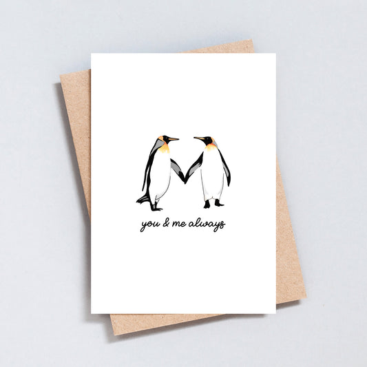 Love card with two penguins holding hands and the text “you & me always”