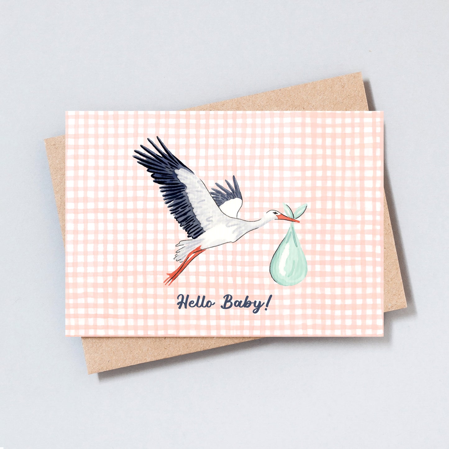 Hand-drawn stork carrying a baby bundle with the text “Hello Baby!” on a peach gingham background.