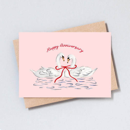 Romantic swan anniversary card with hand-drawn illustration on pink background