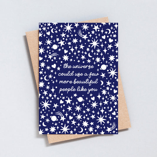 Encouragement greeting card with navy blue starry pattern and the message “The universe could use more beautiful people like you”