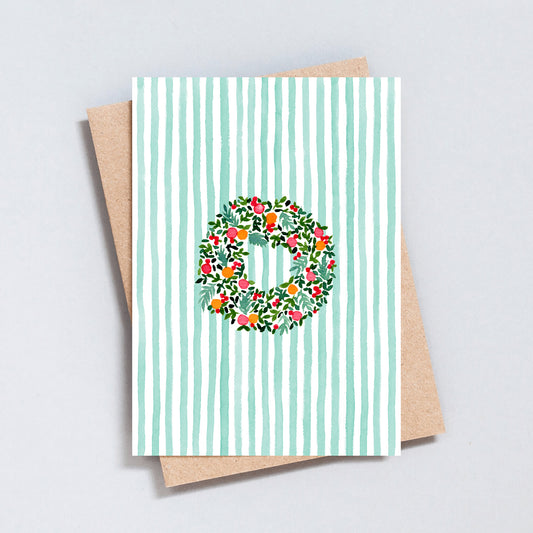 Hand-painted Christmas wreath card with green stripes and kraft envelope by The Type Club.