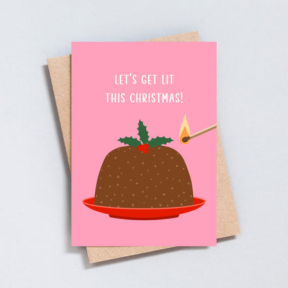 Pink Christmas card with illustrated pudding and match featuring the phrase “Let’s Get Lit This Christmas”